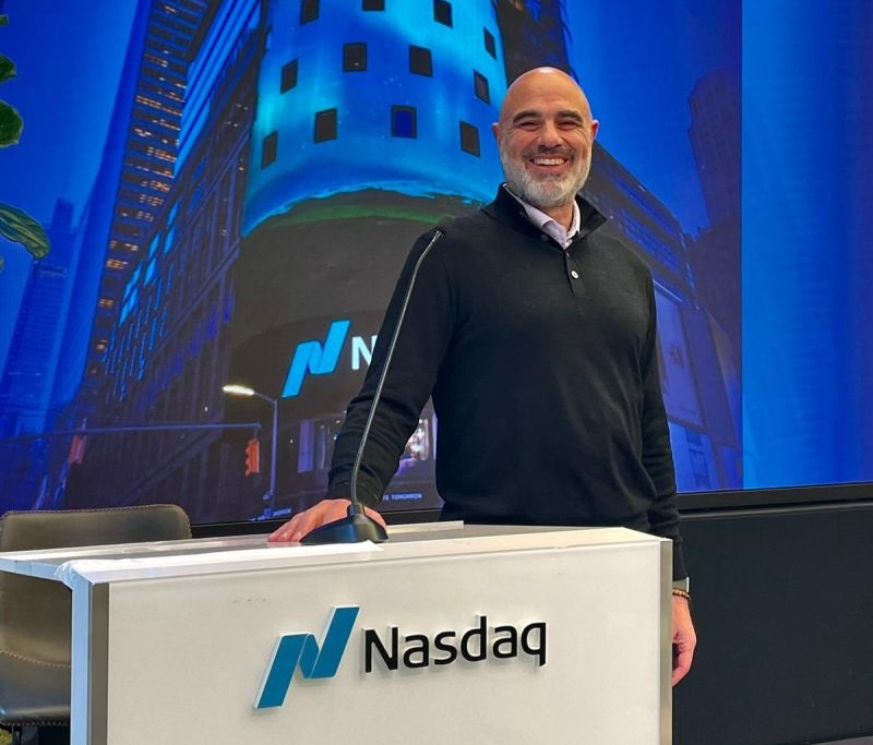 Peter Goldstein speaking at the Nasdaq podium
